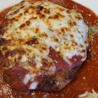 Chicken Parmesan · Lightly breaded chicken breast smothered in our signature marinara sauce topped with parmesa...