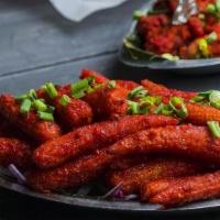 Corn Pepper Fry · Battered golden Kernel corn fried and tossed in the wok with spices.