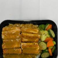 Salmon Curry Don · Cooked salmon with japanese flavor curry sauce on rice and vegetables.