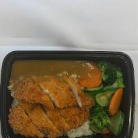 Curry Chicken Katsu (Cutlet) Don · Fried chicken breast with Japanese flavor curry sauce on rice with vegetables.