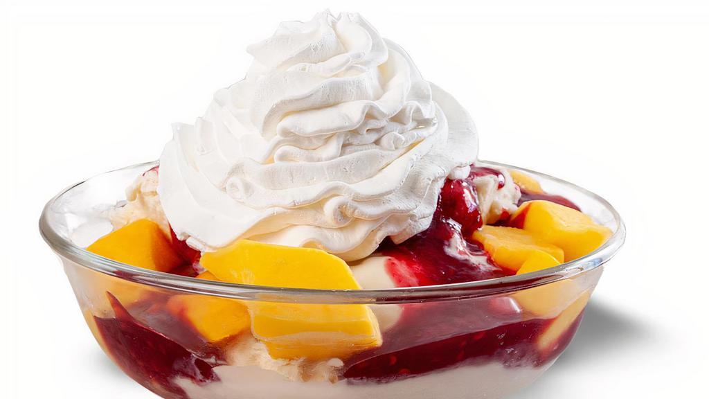 Raspberry Mango Sundae · Vanilla ice cream topped with sweet mango chunks, a tart raspberry puree, and whipped cream.