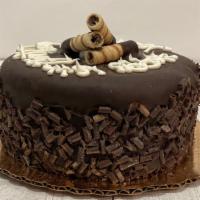 Chocolate Covered Cookies 'N' Cream Ice Cream Cake · Baby cake. Two layers of cookies 'n' cream ice cream with home-made fudge nestled in the cen...