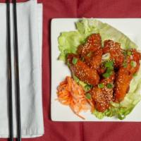 Vietnamese Crispy Chicken Wings · Hot. Your choice of hot and spicy sauce or sweet and tangy tamarind sauce (not spicy). Garni...