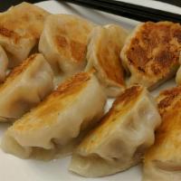 Fried Dumplings · Crispy dumplings, filled with seasoned ground pork and cabbage.