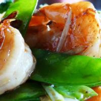 Caramelized Garlic Shrimp (Tôm Rim) · Succulent shrimp seared in a sweet garlic butter sauce.