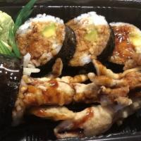Spider Roll · Soft shell crab tempura, cucumber, avocado and masago with eel sauce.