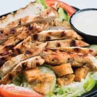 Grilled Chicken Salad · Olives, cucumbers, Lettuce, tomato, onions and grated cheese.