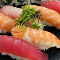 Nigiri Sushi Combo · Seven pieces nigiri sushi and California roll serve with miso soup.