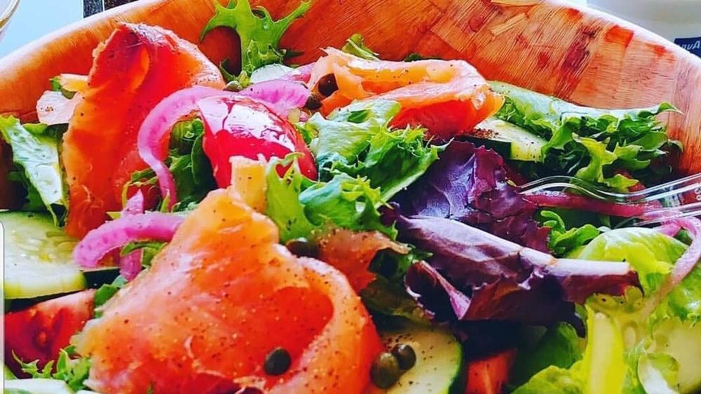 Smoked Salmon Salad · Norwegian smoked salmon, pickled red onion, tomatoes, cucumbers, capers, mixed greens, buttermilk ranch dressing.