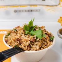 Arroz Chaufa · Steamed basmati rice with soy sauce, rice vinegar, green onion, cilantro, bacon and sesame s...