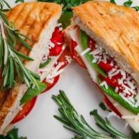 Grilled Tre Cheese Panini · Mild provolone, Asiago, fontina cheese melted with fresh basil, and roasted peppers.