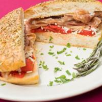 Italian Meat Panini · Fresh imported prosciutto di parma, soppressata, aged asiago cheese, and red roasted peppers.