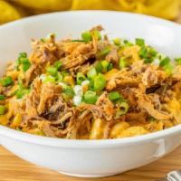 Bbq Pork Mac · Cavatappi pasta and crispy shredded pork topped with bacon, barbecue sauce, cheese sauce, an...