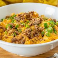 Ground Beef Mac · Enjoy savory ground beef, spicy pickled jalapenos, a rich beer cheese sauce and cheddar chee...