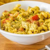 Pesto Chicken · Classic pesto pasta featuring cavatappi topped with Swiss and parmesan cheese, diced chicken...