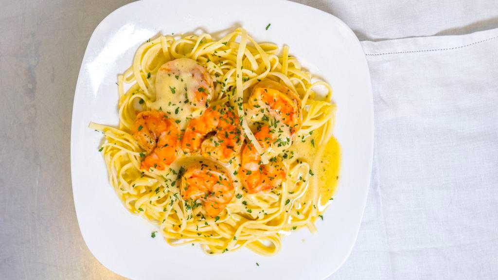 Shrimp Pasta Alfredo · Organic. Fettuccine Pasta in a rich Parmesan cheese and butter Alfredo sauce tossed with shrimp.
