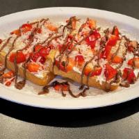 Grounder French Toast · 2 Slices French Toast, Strawberries, Coconut Flakes, Nuttela Drizzle served with Maple Syrup...