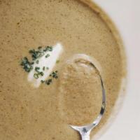 Kennett Square Mushroom Soup · Dairy and gluten. White truffle oil, crème fraîche, and snipped chives.