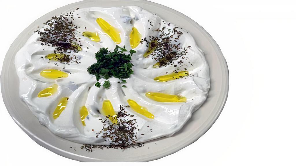 Tzatziki Dip · Yogurt, cucumber, garlic, and dill. Comes with pita bread.