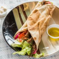 Lamb Gyro · With tzatziki sauce and a side of tzatziki. Lettuce, tomato, onion, parsley, and sauce.