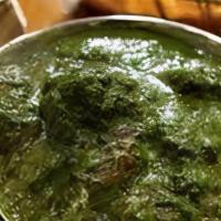 Lamb Saagwala · Tender lamb morsels simmered in delicately spiced spinach with fresh ginger and mint – a mus...