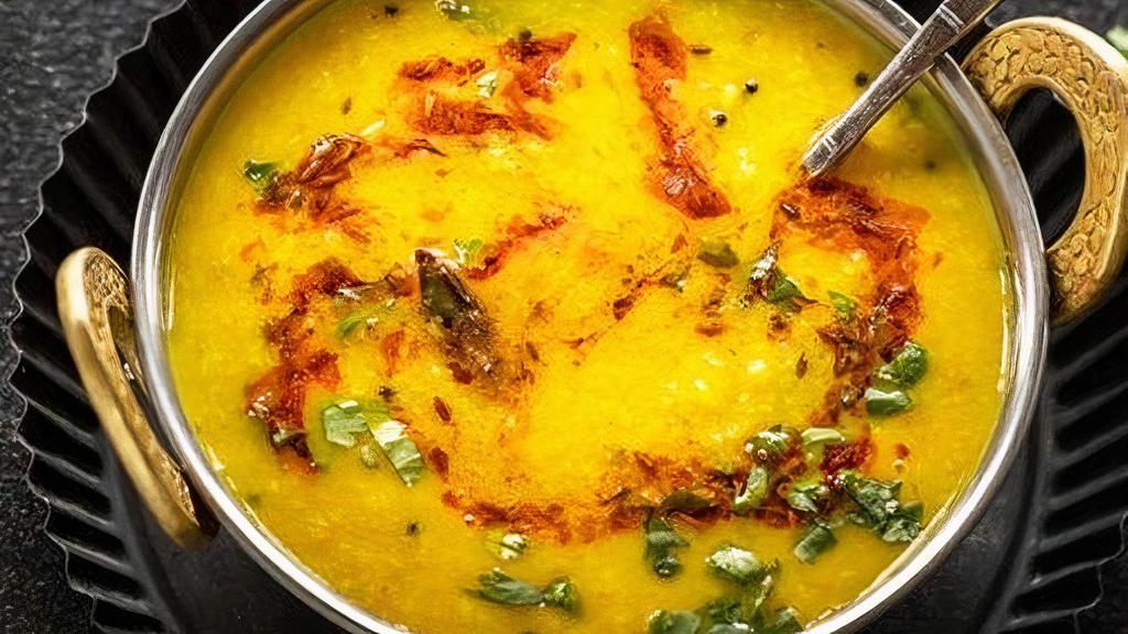Yellow Dal Tarka (V, Gf) · Freshly made yellow lentils with garlic, onions and spices