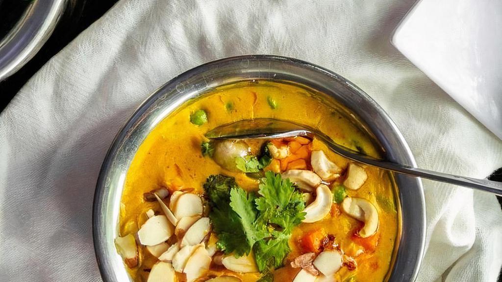 Navrattan Korma (Gf) · A traditional medley of 9 vegetables & nuts cooked in a delicately spiced sauce