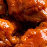 Chicken Wing Combo · Eight chicken wings tossed in buffalo or bbq sauce with fries.