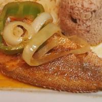 Brown Stew Fish · Fish is seasoned, fried, and cooked in a delicious brown sauce with onion, garlic, and peppe...