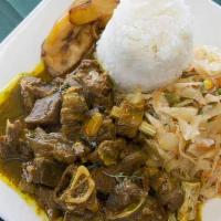 Curry Goat · A delicious mixture of Jamaican curry, island herbs, spices, and fresh vegetables.