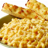 Mac & Cheese · Macaroni in a creamy cheese sauce with Asiago Cheese. Served with a cheese breadstick