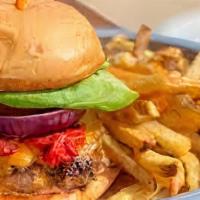 The Sheriff Burger  · 1/2 pound burger, Cajun seasoning, blue cheese crumbles, lettuce, tomato & Texas Sauce.