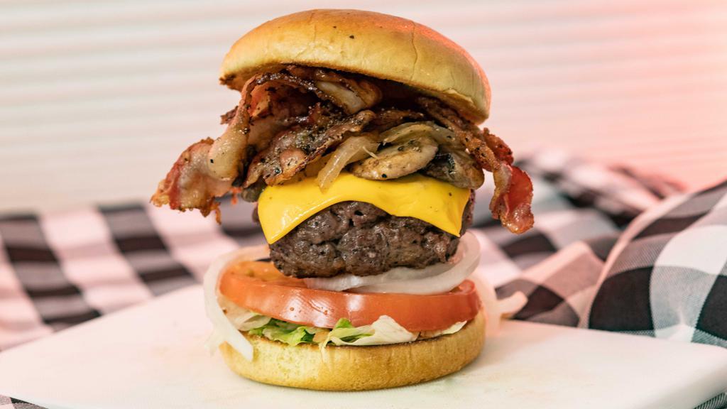 The Cowboy Burger · 1/2 pound burger, lettuce, tomato & Mob Sauce.