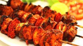 Tandoori Chicken Temper · Marinated in yogurt, fresh ground spices, and cooked in tandoor clay oven.