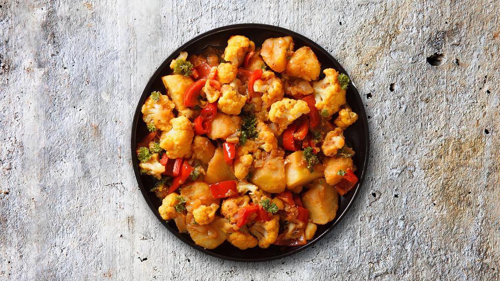 Cauli Potato Crush · Pieces of cauliflower and potato cooked with vibrant flavors of fresh tomatoes, onions, ginger, garlic, and cumin.