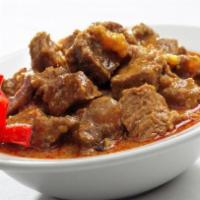 Chicken Vindaloo Fusion · Boneless morsels of chicken slow-cooked in a hot and tangy traditional masala.