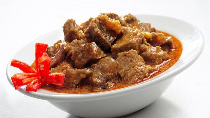 Chicken Vindaloo Fusion · Boneless morsels of chicken slow-cooked in a hot and tangy traditional masala.