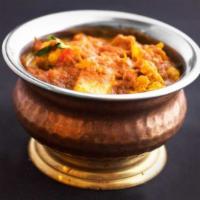 Aloo Gobhi · Vegetarian. Cauliflower, potato, tomato, and cumin. Served with rice.