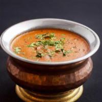 Dal Makhani · Vegetarian. Black lentil, tomato and garlic. Served with rice.