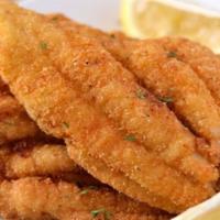 Catfish · Crispy fried catfish fillet served with two side dishes and bread on the side. We fry in pre...