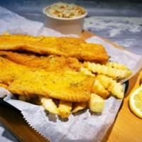 Flounder · Crispy fried flounder fillet served with two side dishes and bread on the side. We fry in pr...