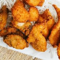 4 Shrimp, 3 Oysters & 2 Whiting · Lightly breaded and fried golden filet of whiting, jumbo shrimp and oysters, served with two...