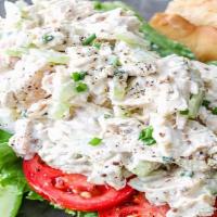 Cold Chicken Salad · Two scoops of chicken salad on a large garden salad.