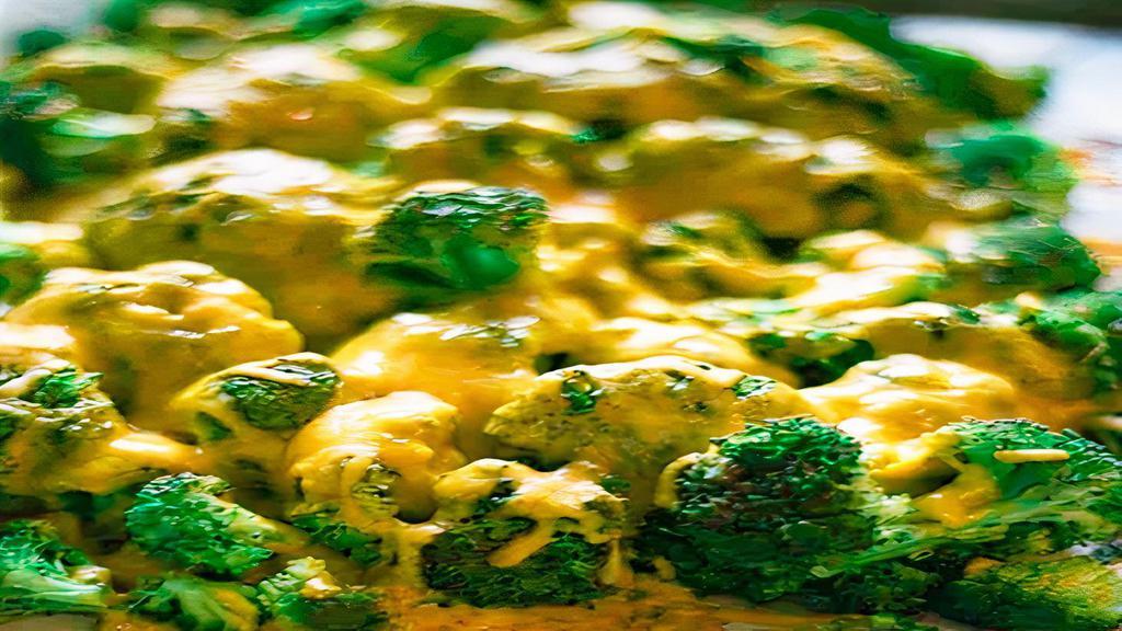 Broccoli & Cheese · Fresh steamed broccoli topped with Cheddar cheese.
