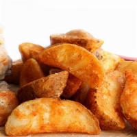 Seasoned Potato Wedges · Crispy thick-cut potato wedges that are seasoned and deep-fried.