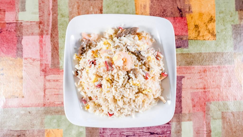 House Special Fried Rice · Served with a light fried rice with shrimp, chicken, roasted pork, beef and eggs.