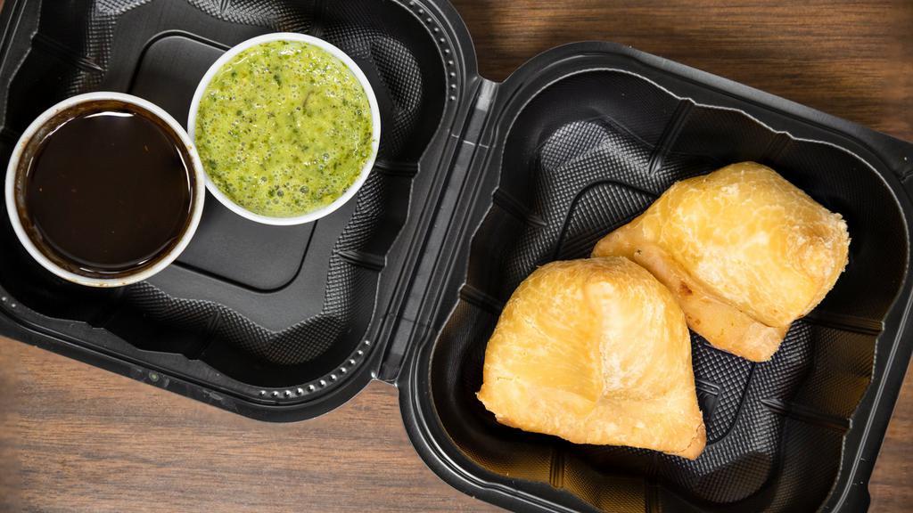 Vegetable Samosa · Vegetarian. Two crisp turnovers filled with mildly spiced potatoes and green peas.