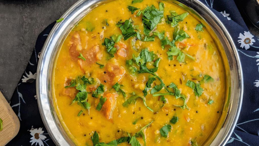 Daal Tadka · Vegetarian, gluten free. Protein rich split yellow lentils cooked with onion ginger and garlic in mild spices.
