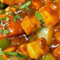Chili Paneer · Gluten free. Cubes of handmade Indian cheese in a sweet and spicy chili sauce with bell pepp...