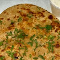 Aalo Paratha · Vegetarian. Whole wheat bread stuffed with seasoned potatoes covered in a buttery spread. Co...